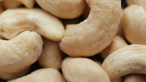 Macro shooting of a cashew nuts heap. Rotating on the turntable Stock Footage 106379767