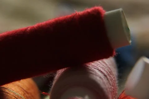 Macro-shooting coils with multi-colored threads. close-up of sewing threads Stock Photos