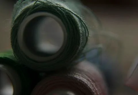 Macro-shooting coils with multi-colored threads. close-up of sewing threads Stock Photos