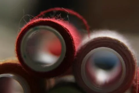 Macro-shooting coils with multi-colored threads. close-up of sewing threads Stock Photos