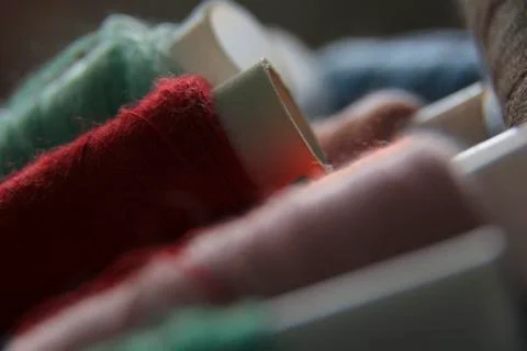 Macro-shooting coils with multi-colored threads. close-up of sewing threads Stock Photos