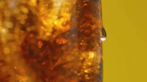 Macro shooting of drop in transparent glass with refreshing cola with bubbles Stock Footage 112146851