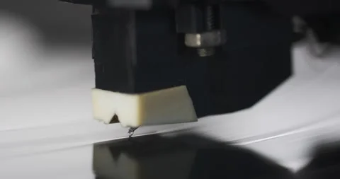 Macro shooting. A pickup with a needle is lowered onto a rotating gramophone Stock Footage 169833508