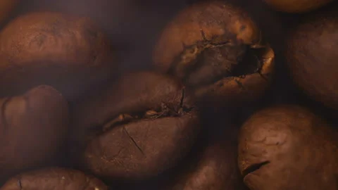 Macro shooting roasted brown and black coffee grains. Stock Footage 101550170