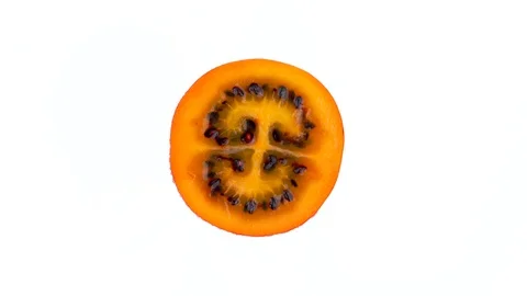 Macro shooting. Top view from above of a ripe tamarillo fruit section Stock Footage 93993136