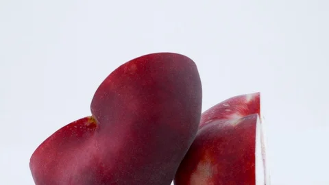 Macro shooting of two halves of a doughnut flat peach with the pit.  Stock Footage 93629427