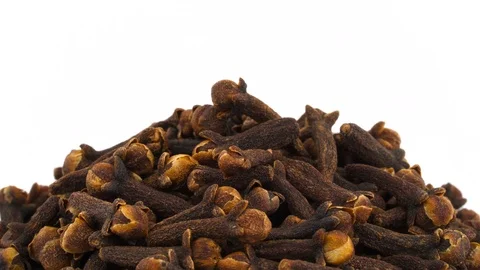 Macro shooting of upper part of dried cloves pile. Rotating on the turntable. Stock Footage 96481160