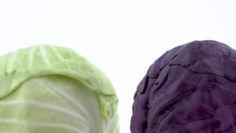 Macro shooting of upper part of two whole mini cabbages. Slowly rotating  스톡 동영상 93842017