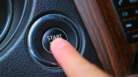 Macro short video finger pressing button to start car engine. Stock Footage 246403665