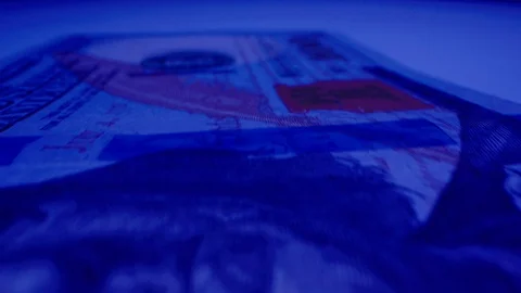 Macro Shot of $100 Bill Under UV Light 01 Stock-Footage 128199978