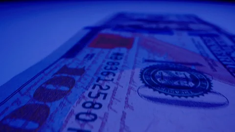 Macro Shot of $100 Bill Under UV Light 03 Stock-Footage 128202367