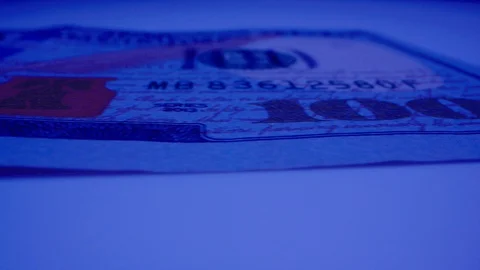 Macro Shot of $100 Bill Under UV Light 06 Stock-Footage 128204182