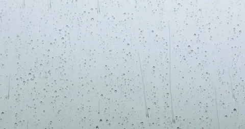 Macro shot of abstract storm rain water drops falling down on window. Selective 動画素材 131306717