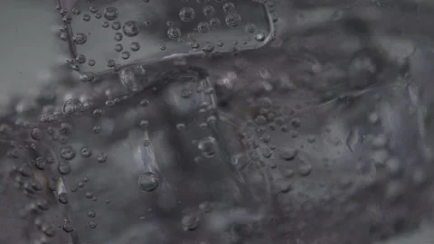 Macro shot of air bubbles in ice cubes, abstract elements in frozen water Stock Footage 208787964