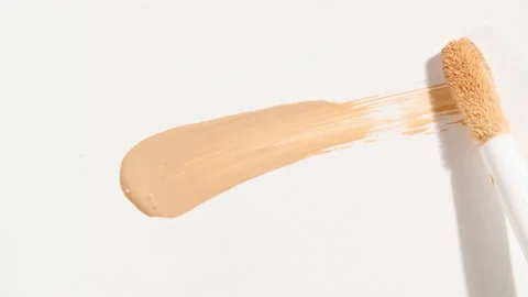 Macro shot and slow motion of a brush, applicator, smear, concealer isolated on Stock Footage 167431942