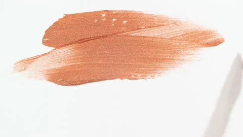 Macro shot and slow motion of a brush, applicator, smear, concealer isolated on Stock Footage 167432043