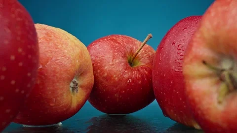 Macro shot of apples with water drops. Dolly shot, move out. Food concept. Stock Footage 244036375