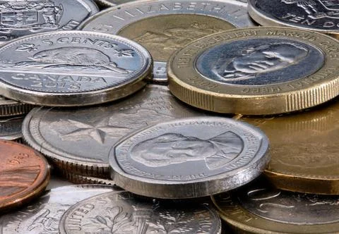 Macro Shot of Assorted Coins from Different Countries Highlighting Details and T Stock Photos