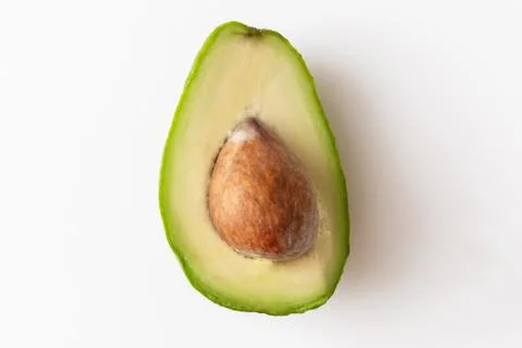 Macro shot of avocedo centered on white background, vegan food with healthy oils Stock Photos