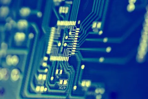 Macro shot of the back side of a circuit board. Close up of the blue circuit Stock Photos