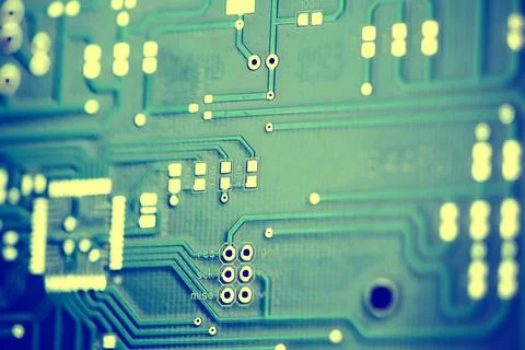 Macro shot of the back side of a circuit board. Close up of the blue circuit Stock Photos