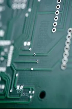 Macro shot of the back side of a circuit board. Close up of a printed green.. Stock Photos
