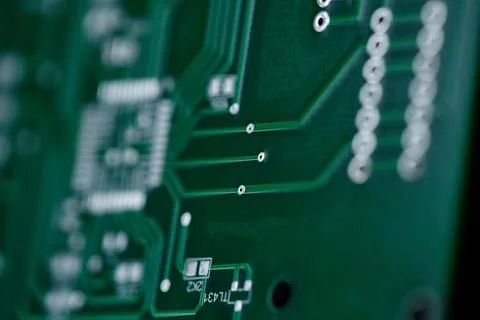 Macro shot of the back side of a circuit board. Close up of a printed green.. Stock Photos