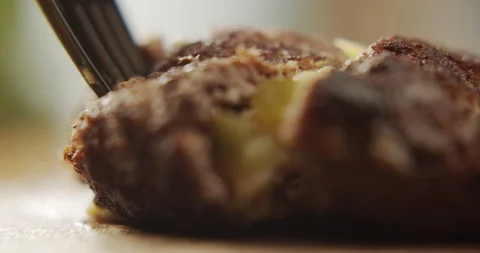 Macro shot of beef cutlet for burger in the context of cheese viscous filling Stock Footage 117405242