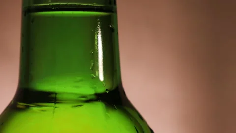 Macro shot of beer bottle with water drop and camera movement Stock Footage 144321830