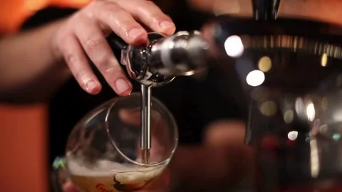 Macro shot of beer Slow Motion Macro video of beer being poured into a glass Stock Footage 265836938