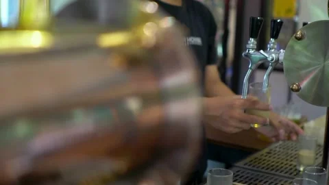 Macro shot of beer Slow Motion Macro video of beer being poured into a glass Stock Footage 265837312