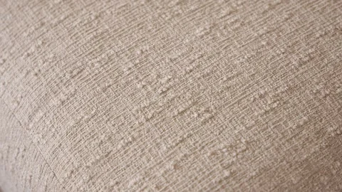 Macro Shot of Beige Linen Sofa Cushion with Detailed Fabric Texture Stock Footage 340398496