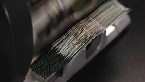 Macro Shot of Bill Counting Machine Counting Cash of 100 Dollar Bills. American Stock Footage 231055074