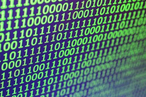 Macro shot of binary code on the monitor of an office computer. The concept o Stock Photos