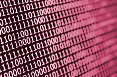 Macro shot of binary code on the monitor of an office computer. The concept of Foto stock