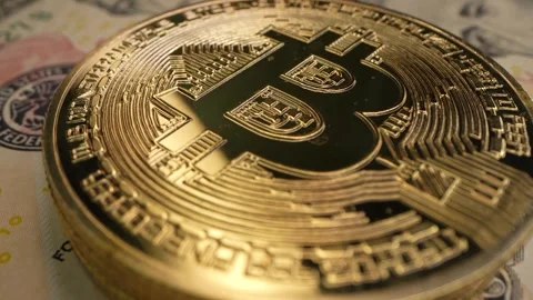 Macro shot of Bitcoin coins. 4K video of BTC. Golden Bitcoin, crypto currency Video stock 240934084