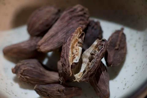 MACRO SHOT OF BLACK CARDAMOM SPLIT UP Stock Photos