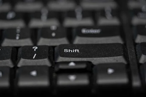 Macro Shot of a Black Computer Keyboard with Focus on the Shift and Enter Key Stock Photos