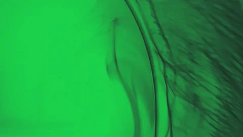 Macro Shot, Black paint in green water Stock Footage 197416853