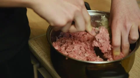 Macro shot of blending raw minced meat filling Stock Footage 340078055