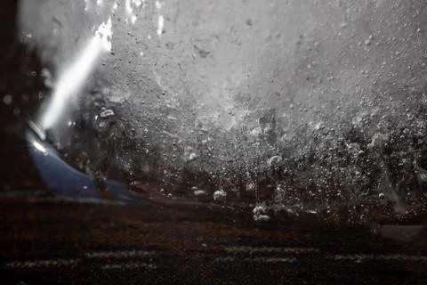 Macro shot of a block of ice with embedded air bubbles and textures Stock Photos