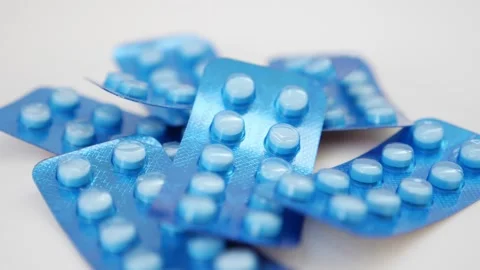 Macro shot of blue color tablets packet view Stock Footage 147699310