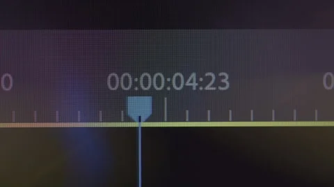 Macro Shot of Blue Playhead Moving Across a Timeline on an Editing Program Stock-Footage 270312610