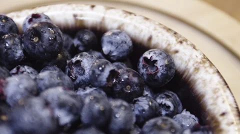 Macro shot of blueberries rotating on the breakfast table. Stock Footage 62910625