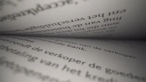 Macro shot into book with multiple black Phrases 動画素材 124014611