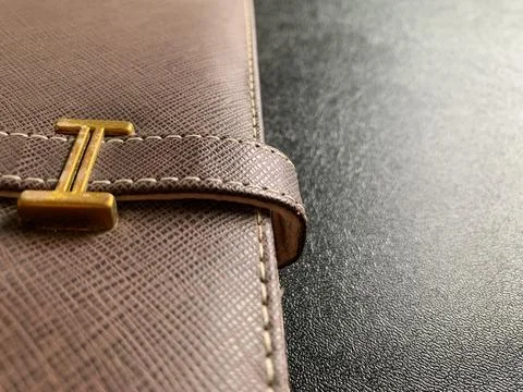 Macro Shot of Brown Leather Notebook Strap on Dark Desk in Jakarta Indonesia Stock Photos