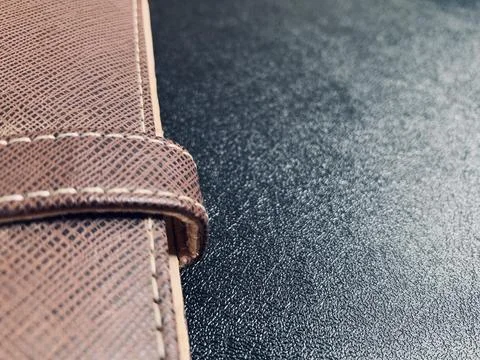 Macro Shot of Brown Leather Notebook Strap on Dark Desk in Jakarta Indonesia Stock Photos