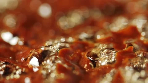 Macro shot of bubbles in boiling thick liquid, shallow depth of field. Stock Footage 212078522