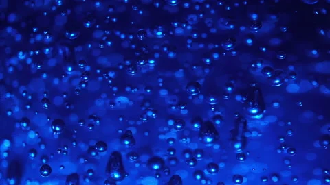 Macro shot of bubbles on illuminating blue background. Frozen bubbles concept Stock Footage 147612306
