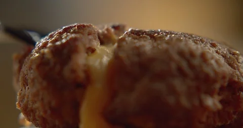 Macro shot of burger cutlet with flowing cheese filling. Slow motion video Stock Footage 116099852